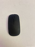 Top view of slim black wireless mouse
