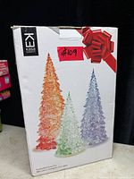 Retail box front showing images of the three original acrylic LED trees and brand information