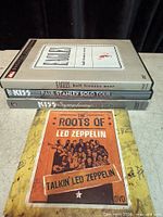All four DVDs stacked showing spines and Led Zeppelin cover on top