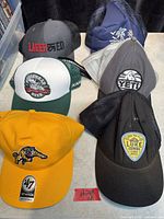 All six baseball caps front view