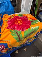 Throw blanket showing floral pattern and border