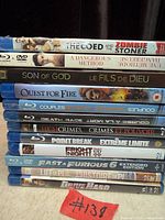 Stack of 13 Blu-ray movie cases showing all visible spine titles