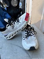 Side view showing On logo, mesh upper, CloudTec midsole