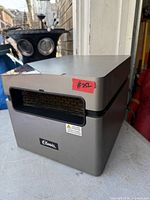 Front and side view of Classic space heater showing brand label and vent