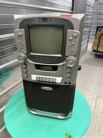 Front view of Craig graphics karaoke system showing CRT screen, controls and speakers