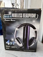 Front of retail box showing model SF878 wireless headphone set