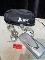 Adapter, cables, and pouch arranged on surface