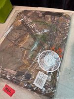 Sealed camouflage hoodie in bag