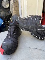 Front and side view of Salomon Gore-Tex shoes showing Quicklace system and overall condition