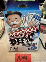 Front of sealed Monopoly Deal box showing branding, age rating, playtime