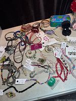 Overview of entire jewelry lot spread on table