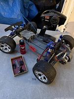 RC chassis, transmitter, oil bottle, small parts