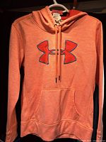 Front view showing logo, pocket, drawstrings