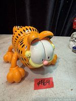 Front left perspective of Garfield massager showing eyes, paws and overall condition