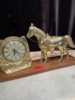 Front view showing clock dial and horse figure
