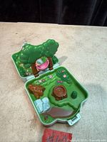 Playset open showing right side with tree and pond features