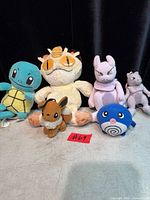 Front view of all six Pokémon plush toys displayed together