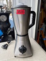 Full view of Toastess stainless steel blender showing base, jar, handle, dial and cord