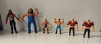Group shot of all six wrestling action figures standing in a row
