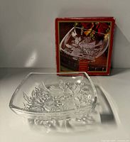 Square clear glass bowl in front of its box