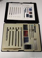 Open JML Classic PenSet case with Cross gold pen at left and multiple components