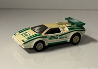 Front-left perspective of Hess sports car showing hood logo and side stripes