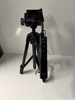 Full view of Sony VCT-60AV tripod with remote handle attached