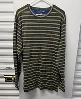 Front view of striped long-sleeve shirt on hanger