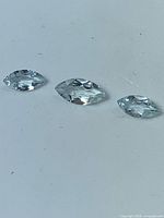 Three marquise-cut aquamarines lined in a row