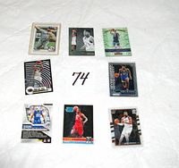 All eight sports cards laid out 3×3 grid showing fronts and one back