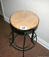 Top view of stool showing wooden seat