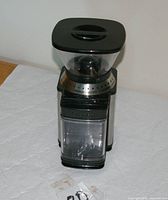 Front view showing stainless sides, clear grounds bin, hopper