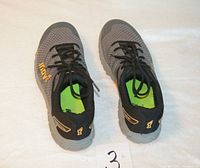 Top view showing both shoes, laces, color scheme and size tag