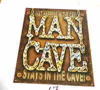 Front view of printed Man Cave tin sign showing design and text