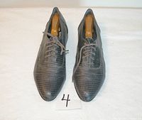 Top view of grey reptile-pattern dress shoes size 10.5