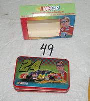Metal tin lid with Jeff Gordon car and portrait, open cardboard sleeve