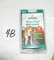 Front of sealed Sporn Non-Pull Mesh Harness package showing branding, medium size, dog image