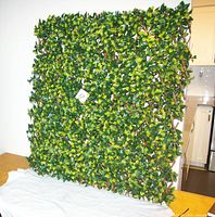 Front view of faux leaf privacy fence panel showing foliage and lattice