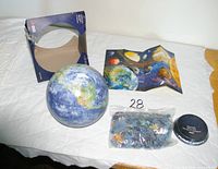 Full contents: assembled globe, stand, box, leaflet, bag of pieces