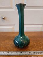 Full side view showing height, bulbous base and glaze pattern