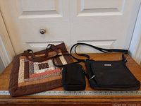 All three bags displayed together against ruler for scale