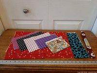 Overview of all fabric pieces laid out with ruler