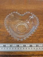 Top view showing heart shape, beaded rim and central circular base