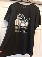 Full view of front of T-shirt showing design and size