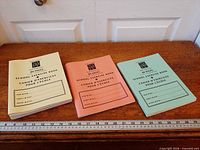 Three pastel exercise books front view