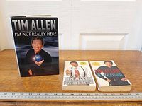 All three Tim Allen books with ruler for scale
