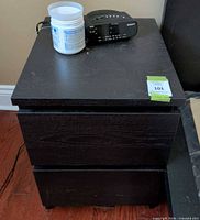 Front view of black 2-drawer night table