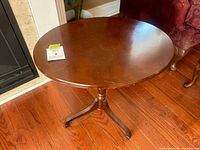 Full view of oval wood pedestal table