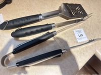 Top view of three BBQ utensils showing full length and handles