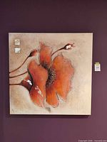 Front view of square canvas painting showing red flower and textured beige background